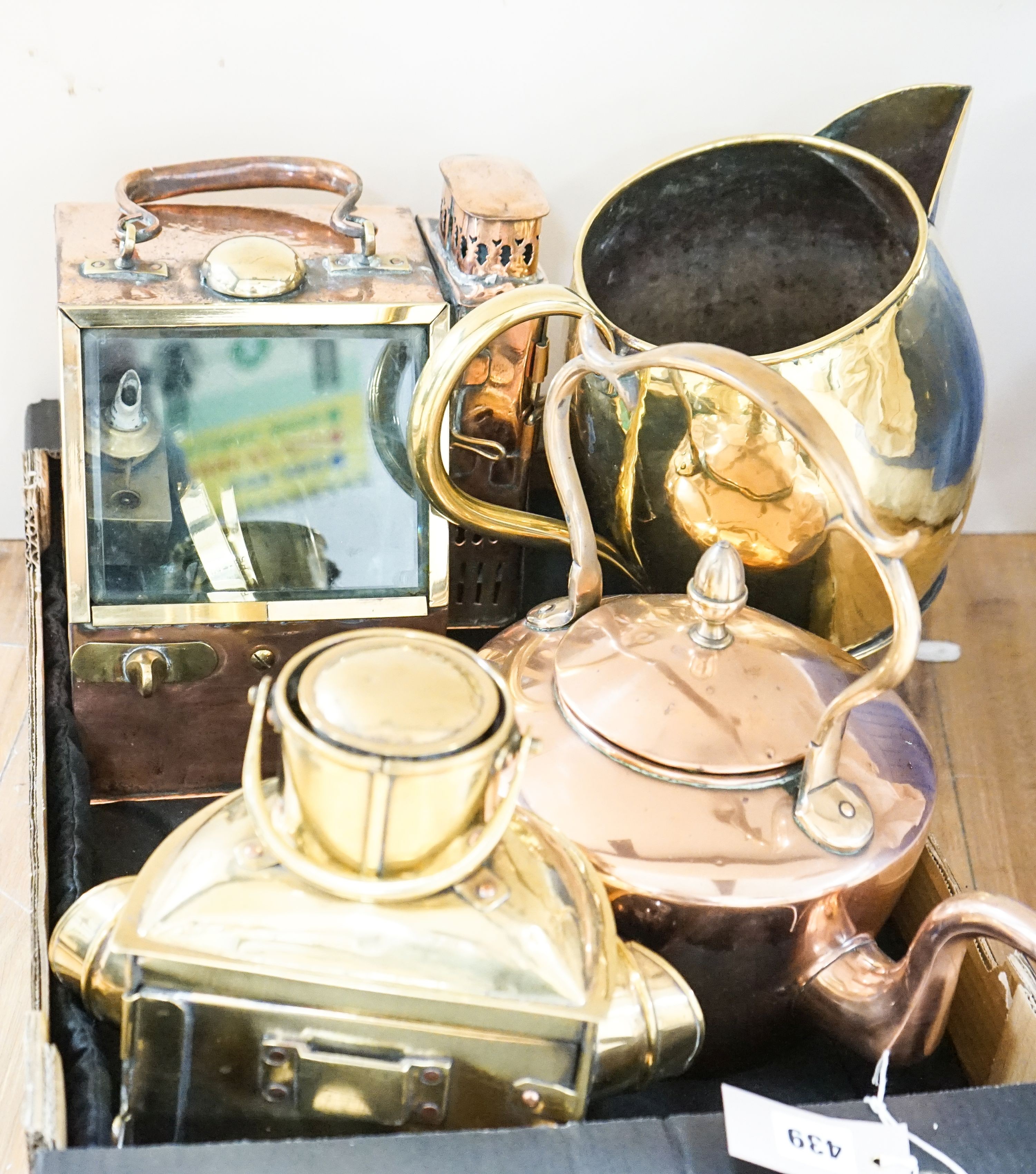 A copper ship's binnacle compass, a brass oil lamp, a brass jug and a copper kettle